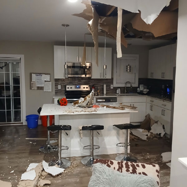 Collapsed kitchen ceiling from leaking pipes